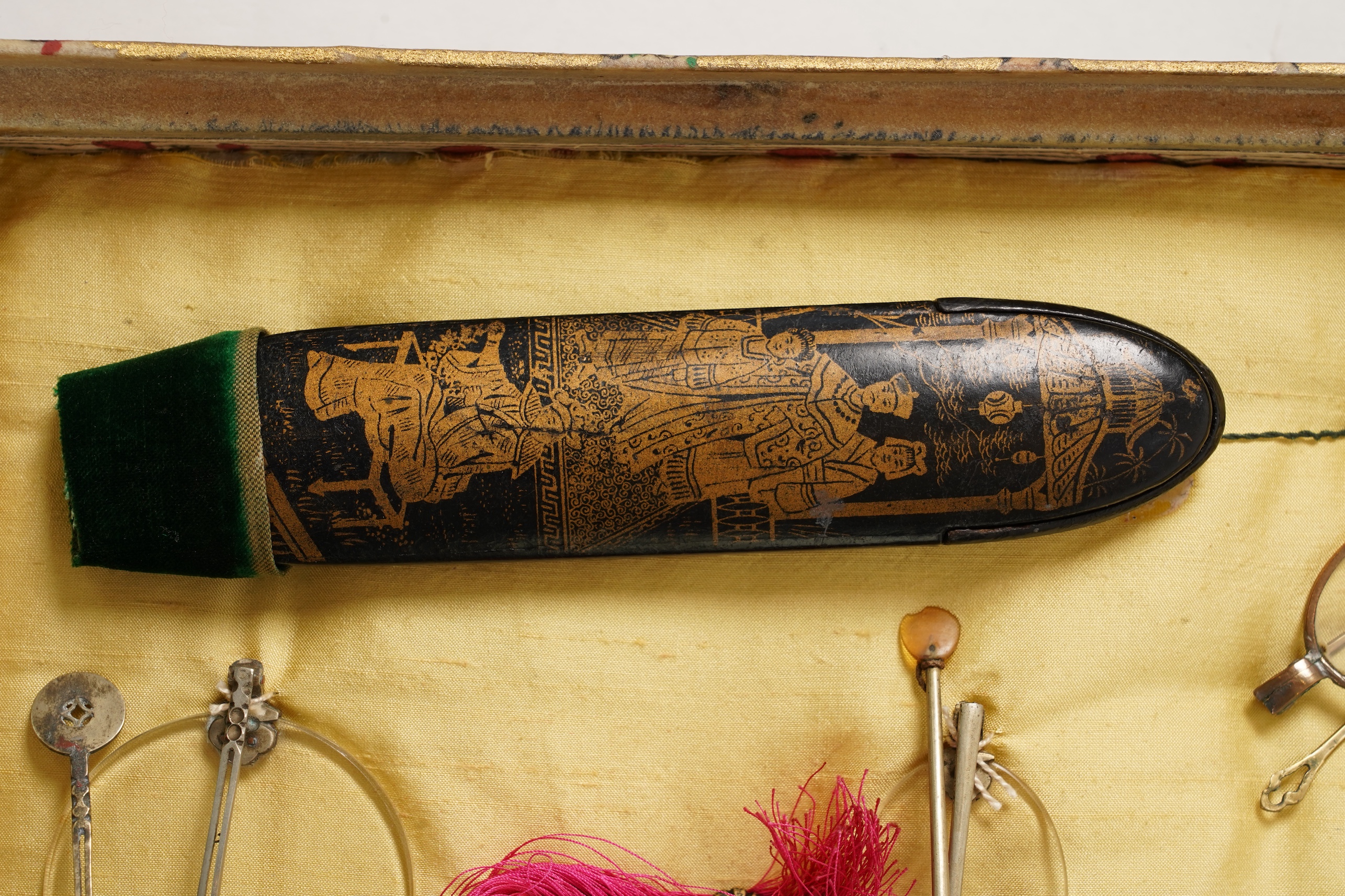 A collection of 19th/20th century Chinese embroidered silk spectacle cases and various spectacles, Box 33cm square